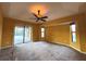 Bright bedroom with ceiling fan and carpeted floors at 2913 Rufus Rd, North Port, FL 34288