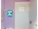 Cozy bathroom featuring a lavender wall, with decorative towels on the towel rack at 3097 Royal Palm Dr, North Port, FL 34288