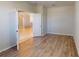 Spacious bedroom featuring wood floors and view into the hall at 3097 Royal Palm Dr, North Port, FL 34288