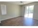 Bedroom with hardwood floors and a large glass sliding door at 3097 Royal Palm Dr, North Port, FL 34288