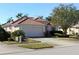 Charming one-story home with a tile roof, well-maintained landscaping, and a two-car garage at 3097 Royal Palm Dr, North Port, FL 34288