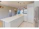 Open kitchen featuring pendant lighting and white countertops at 3097 Royal Palm Dr, North Port, FL 34288