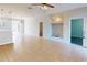 Open floor plan featuring tile flooring, neutral walls, and a view into the kitchen and beyond at 3097 Royal Palm Dr, North Port, FL 34288