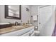 Bathroom with granite countertop and a large mirror at 3310 Middletown St, Port Charlotte, FL 33952