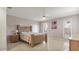 Bright bedroom with a wooden bed frame and tiled floors at 3310 Middletown St, Port Charlotte, FL 33952