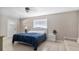 Bedroom with a queen-size bed, nightstand, and couch at 3310 Middletown St, Port Charlotte, FL 33952
