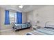 Bedroom with twin beds, nightstand and blue curtains at 3310 Middletown St, Port Charlotte, FL 33952