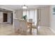 Bright dining room featuring a glass-top table and four chairs at 3310 Middletown St, Port Charlotte, FL 33952