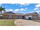 Two-story house with stone exterior and a two-car garage, great curb appeal at 3310 Middletown St, Port Charlotte, FL 33952
