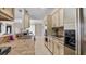Long kitchen with stainless steel appliances and tile countertops at 3310 Middletown St, Port Charlotte, FL 33952
