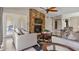 Living room with fireplace, access to patio, and view to dining area at 3310 Middletown St, Port Charlotte, FL 33952