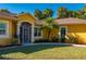 House exterior showcasing a screened-in entryway and landscaping at 3619 Coquina Ave, North Port, FL 34286