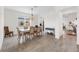 Formal dining room with a light wood table and six chairs at 43660 Tree Top Trl, Punta Gorda, FL 33982