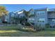 Charming condo building with attractive landscaping and ample parking at 4410 Warren Ave # 118, Port Charlotte, FL 33953