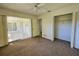 Bedroom with patio access and a large closet at 6222 Berkeley St, Englewood, FL 34224