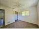 Spacious bedroom with a large closet and window at 6222 Berkeley St, Englewood, FL 34224