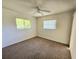 Bright bedroom with carpet flooring and ceiling fan at 6222 Berkeley St, Englewood, FL 34224