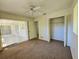 Bedroom with patio access and a large closet at 6222 Berkeley St, Englewood, FL 34224