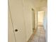 Hallway with tile floors and access to bedrooms and closets at 6222 Berkeley St, Englewood, FL 34224
