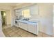 White kitchen with appliances and tile floor at 6222 Berkeley St, Englewood, FL 34224