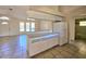 White kitchen cabinets and appliances, tile floor at 6222 Berkeley St, Englewood, FL 34224