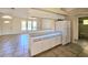White kitchen cabinets and appliances, tile floor at 6222 Berkeley St, Englewood, FL 34224