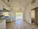 Kitchen with view to backyard and access to dining area at 6222 Berkeley St, Englewood, FL 34224