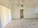 Spacious living room with tile floors and lots of natural light at 6222 Berkeley St, Englewood, FL 34224