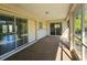 Covered porch with view of the backyard at 6222 Berkeley St, Englewood, FL 34224