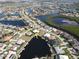 Aerial view of a waterfront community with private docks and beautiful homes, including the listed property at 649 Maltese Dr, Punta Gorda, FL 33950