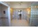 Large bathroom with double sinks, tile flooring, walk-in shower, and ample storage space at 649 Maltese Dr, Punta Gorda, FL 33950