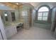 Elegant bathroom with a bathtub, shower, and double vanity at 649 Maltese Dr, Punta Gorda, FL 33950