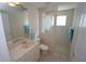 Bathroom featuring neutral tones and decor including tile flooring and vanity with marble countertop at 649 Maltese Dr, Punta Gorda, FL 33950