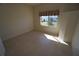 Simple bedroom with tile flooring and large window at 649 Maltese Dr, Punta Gorda, FL 33950