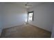 Bedroom featuring carpeted flooring, a window with sunlight and a ceiling fan at 649 Maltese Dr, Punta Gorda, FL 33950