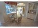 Bright breakfast nook with a view of the pool and access to the outdoor area at 649 Maltese Dr, Punta Gorda, FL 33950