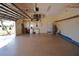 Spacious garage with an epoxy floor, ample storage cabinets, and an automatic door opener system at 649 Maltese Dr, Punta Gorda, FL 33950