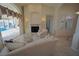 Bright and open living room with a fireplace, sliding glass doors to the pool, and comfortable seating at 649 Maltese Dr, Punta Gorda, FL 33950
