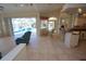Spacious living room opens to the kitchen and breakfast nook with pool view at 649 Maltese Dr, Punta Gorda, FL 33950
