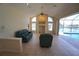 Bright living room features high ceilings, large windows, and view of the backyard pool at 649 Maltese Dr, Punta Gorda, FL 33950