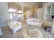 Bright living room featuring ample seating, arched doorways, and a view of the entrance at 649 Maltese Dr, Punta Gorda, FL 33950