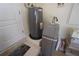 Utility room with water heater and water softener at 649 Maltese Dr, Punta Gorda, FL 33950