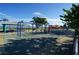 Community playground with swings, play structures, and picnic tables at 649 Maltese Dr, Punta Gorda, FL 33950