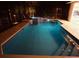 An elegant pool area is brightly illuminated for comfortable evening enjoyment at 649 Maltese Dr, Punta Gorda, FL 33950