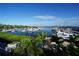 Picturesque water view of a marina filled with yachts, boats, and lush greenery in this beautiful coastal setting at 649 Maltese Dr, Punta Gorda, FL 33950