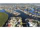 Aerial view of waterfront home in a residential community at 726 Macedonia Dr, Punta Gorda, FL 33950