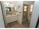 Main bathroom with shower and updated vanity at 726 Macedonia Dr, Punta Gorda, FL 33950
