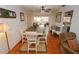 Dining room with hardwood floors, a wooden table, and access to a patio at 726 Macedonia Dr, Punta Gorda, FL 33950