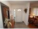 Bright and airy entryway with a white door and hardwood flooring at 726 Macedonia Dr, Punta Gorda, FL 33950