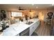 Modern kitchen featuring a large island with seating and white shaker cabinets at 726 Macedonia Dr, Punta Gorda, FL 33950